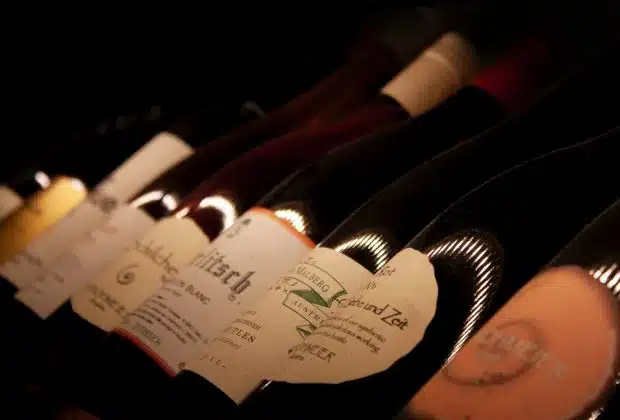 white labeled bottles on brown wooden table