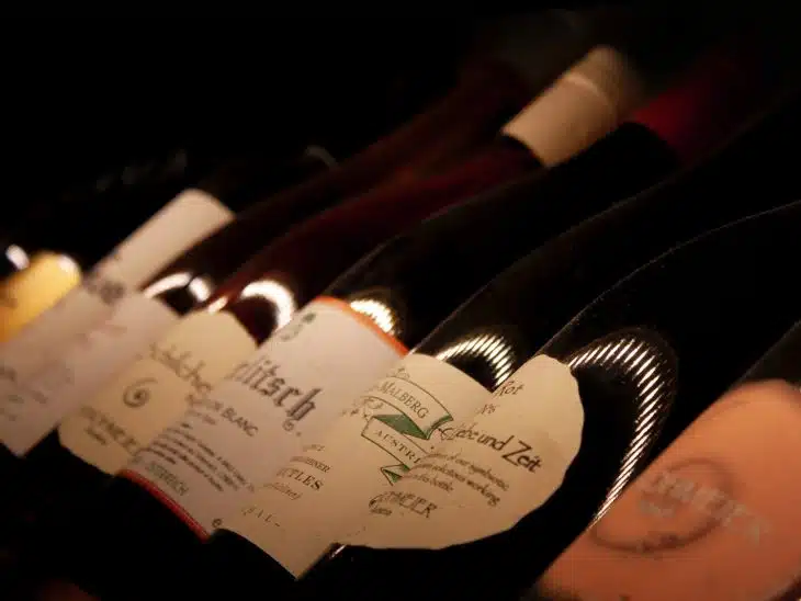 white labeled bottles on brown wooden table